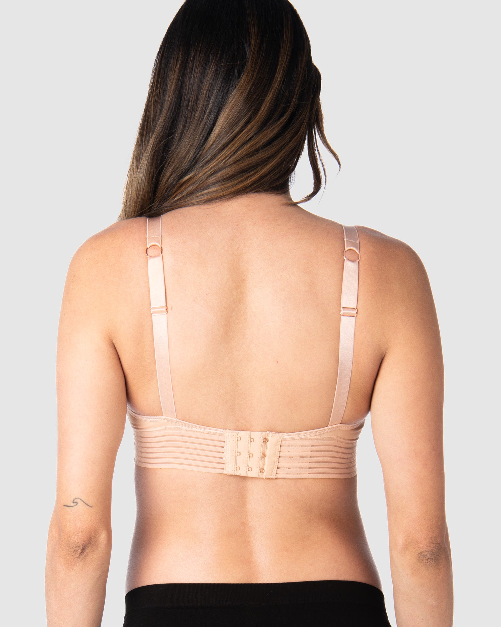 Kami, expecting mother of 2, demonstrating the versatile standard or convertible racerback feature of Hotmilk AU&#39;s Ambition T-Shirt Wirefree nursing and maternity bra in shell pink, designed for maternity, nursing, and breastfeeding comfort