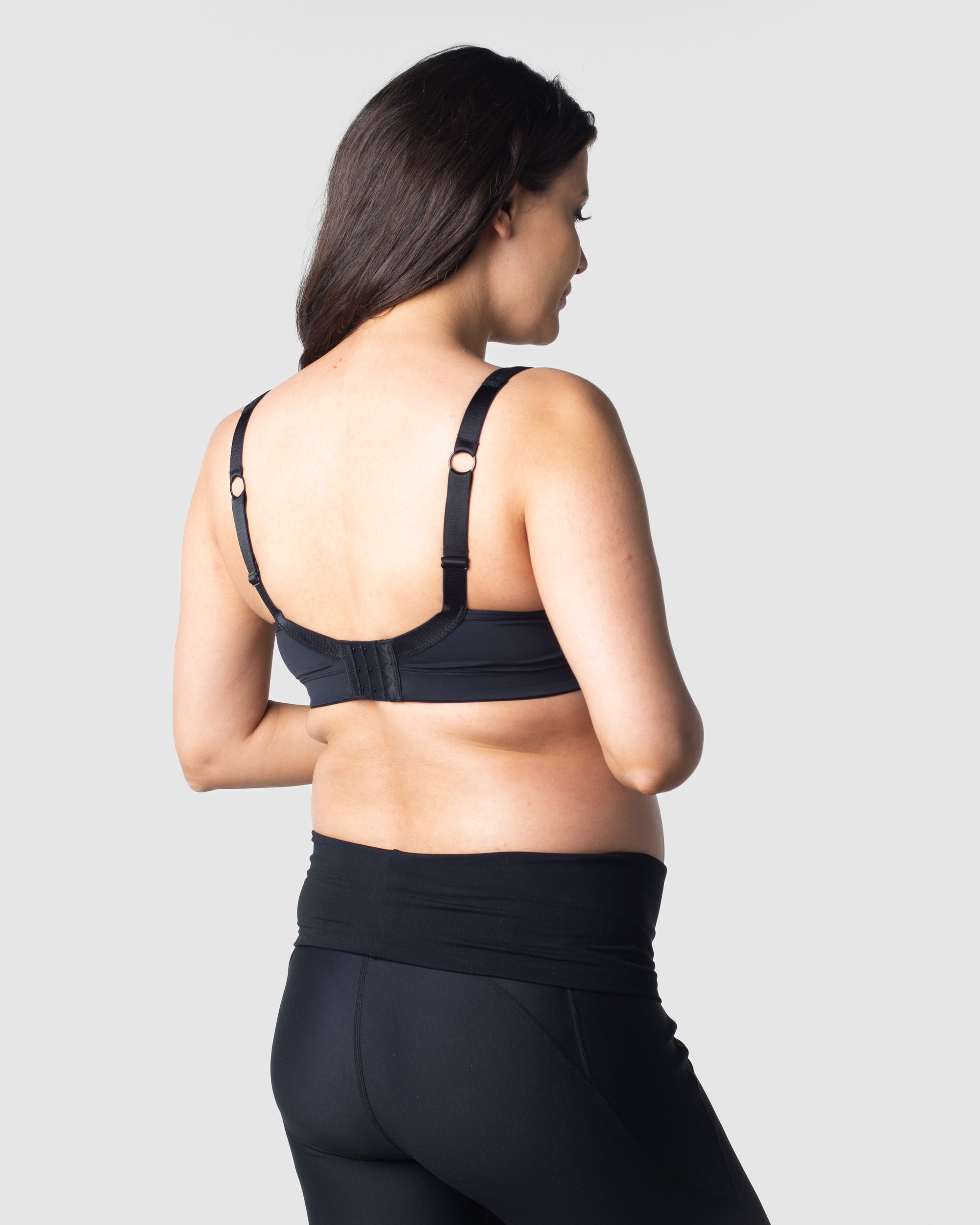 Julia, a mother of one, showcases the ease of Hotmilk Lingerie&#39;s Balance Sports Crop Bra nursing traditional brack, alternatively, it can be worn racerback style. Expertly designed for mothers on the go, this bra is perfect for light exercise, yoga, and pilates during both pregnancy and nursing. Elevate your active lifestyle with the seamless combination of functionality and style provided by Hotmilk Lingerie&#39;s Balance Sports Crop Bra